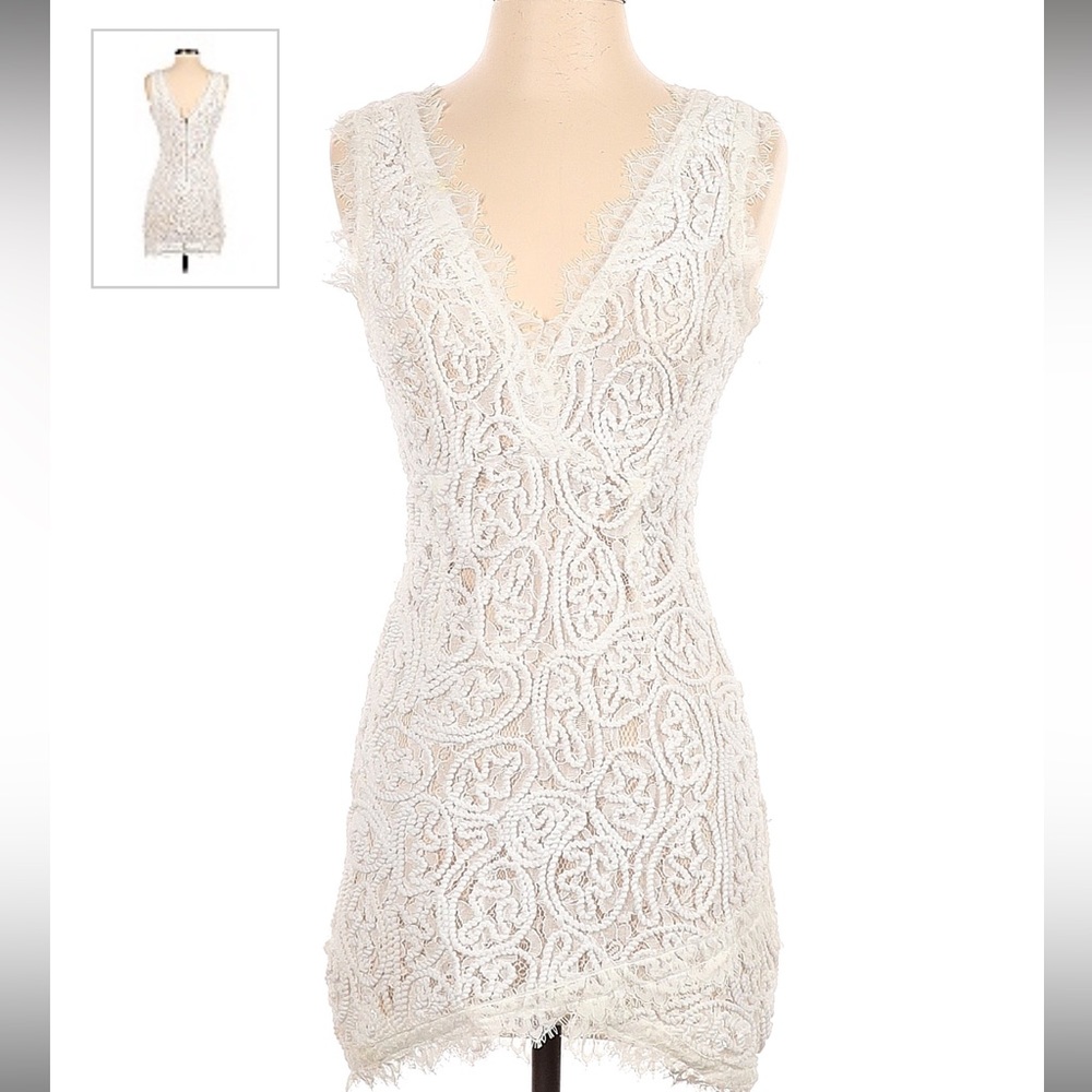 A. peach white dress bought from nasty gal